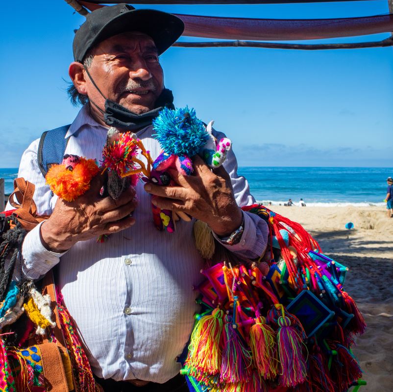 smiling vendor on beach puerto vallarta