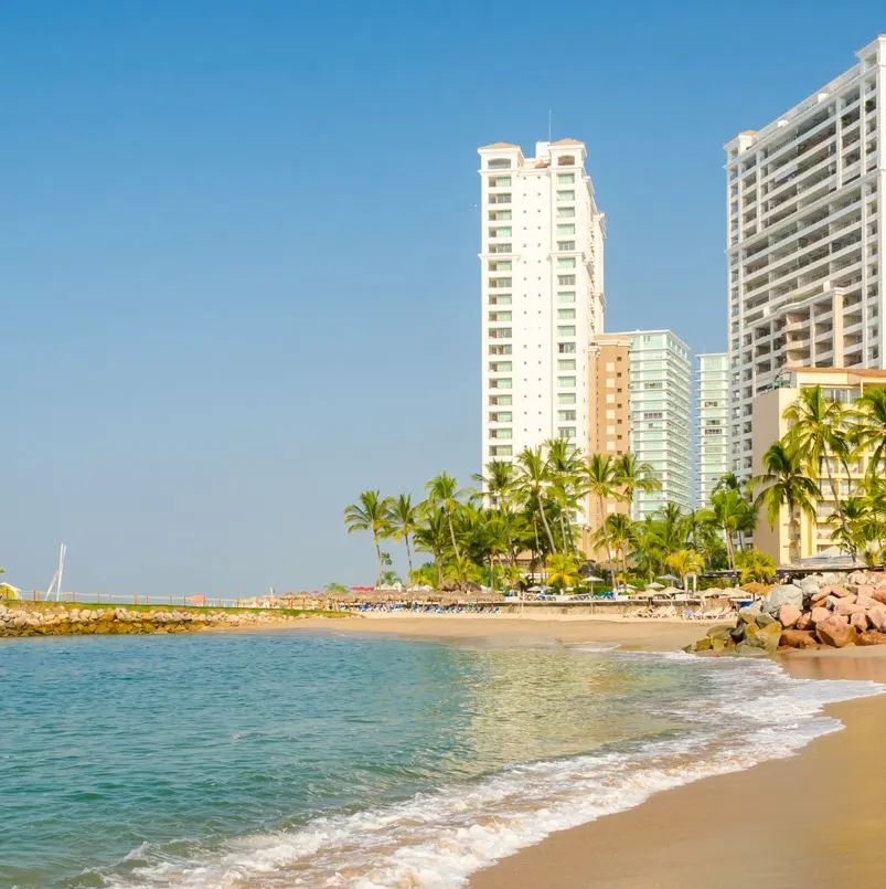 beach in puerto vallarta with buildings