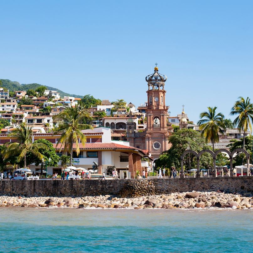 view of old town puerto vallarta showing malecon and church