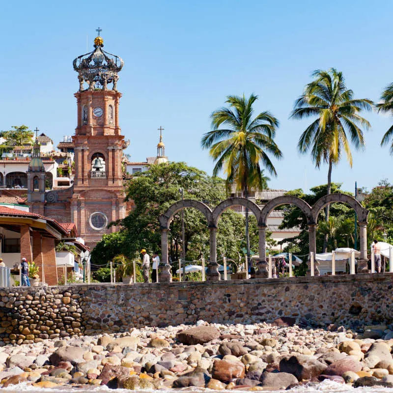 historic landmarks in puerto vallarta with palm trees
