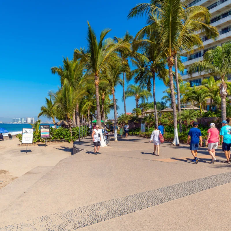 Puerto Vallarta, Colorful shops, cafes, hotels and souvenir booths line the seaside promenade boardwalk at Los Muertos Olas Altas beach