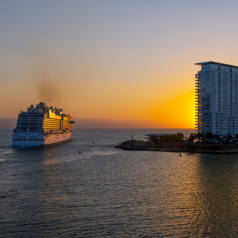 Sunset evening view of the Princess Discovery cruise ship as it exits the cruise port of Puerto Vallarta, Mexico