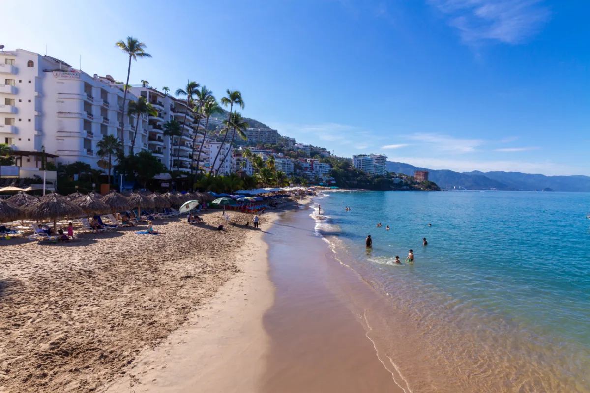 People on a beach in Puerto Vallarta on a cloudy day